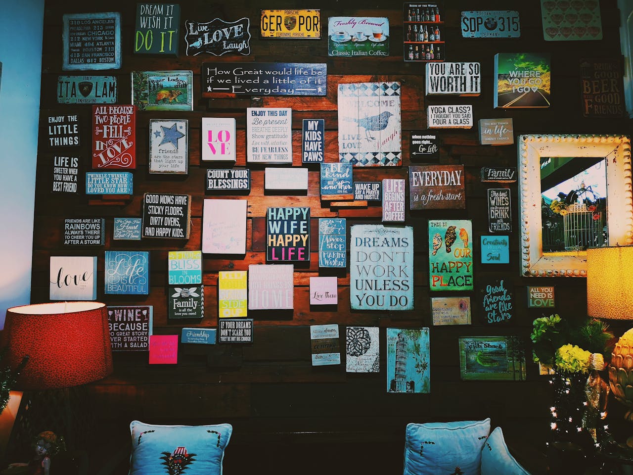 A warm and inviting indoor space with motivational quotes displayed on a wooden wall.